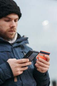 Man making cell phone payment